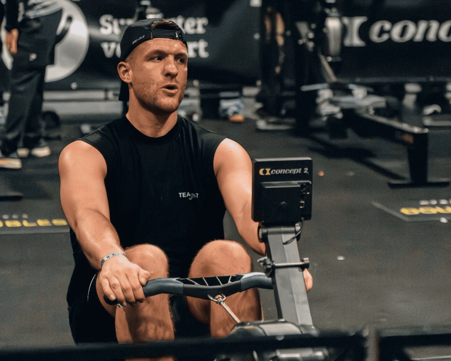 An athlete on the rowing station during a HYROX race